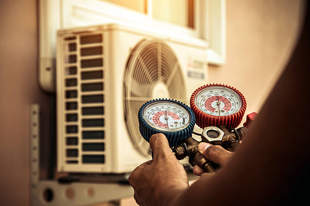 Professional Heat Pump Repair technician working in Lee's Summit, MO